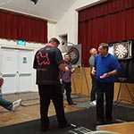 Scott playing his uncle, Ray Drake at Sway Village Hall. Ray had won the lowest score comp to play Scott.